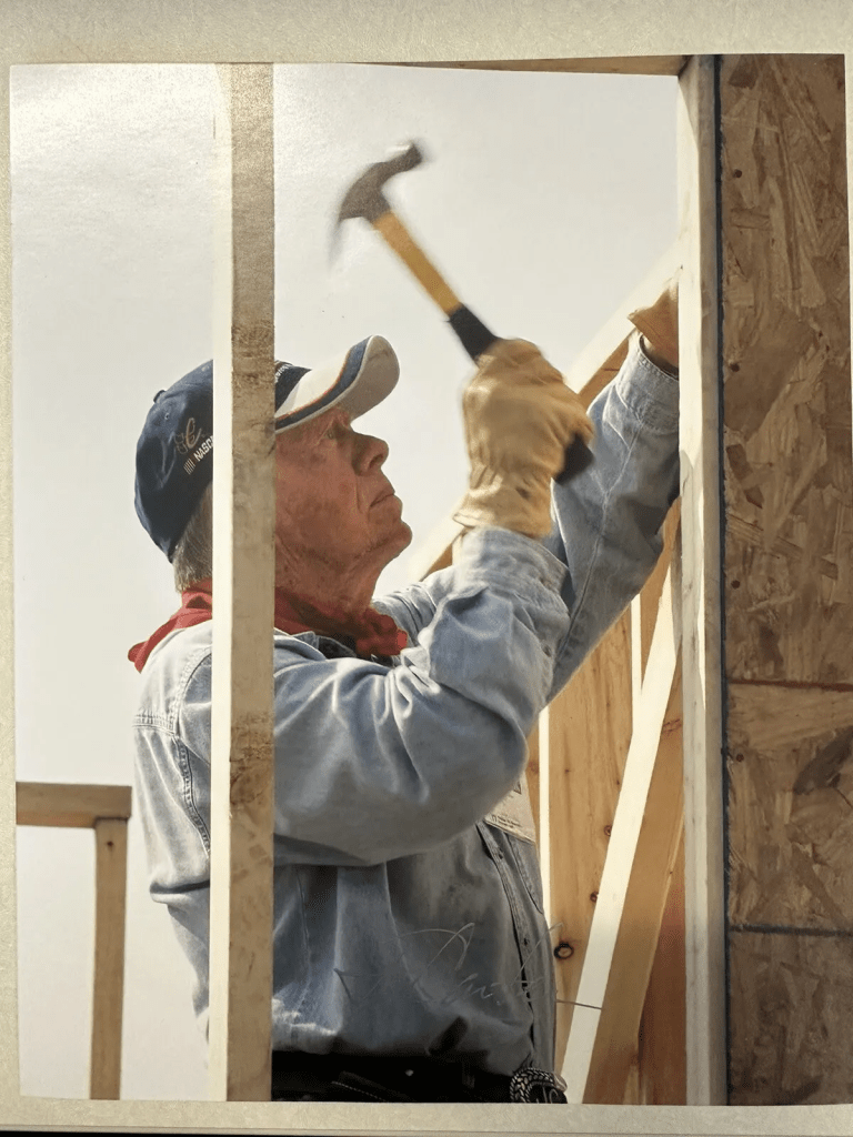 Jimmy Carter building a house